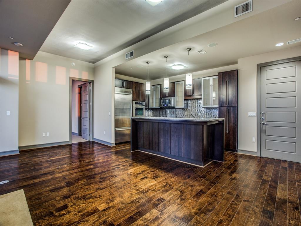 a view of kitchen with cabinets