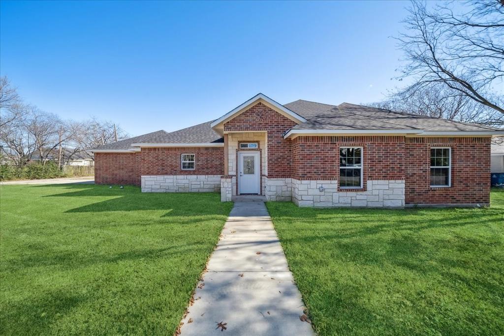 a front view of a house with yard