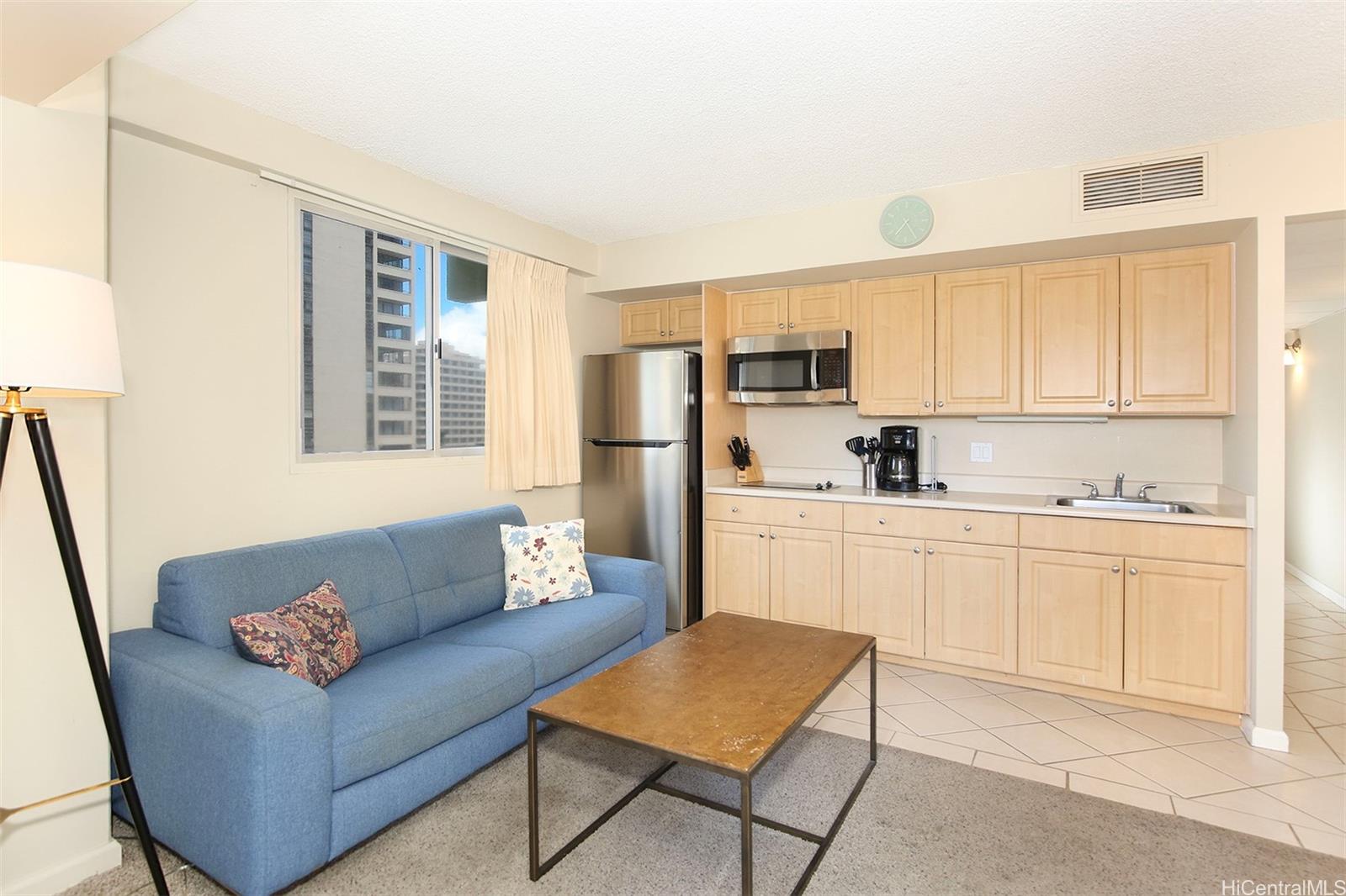 a kitchen with stainless steel appliances granite countertop a refrigerator sink and cabinets