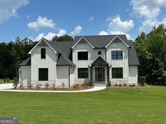 a front view of house with yard and green space