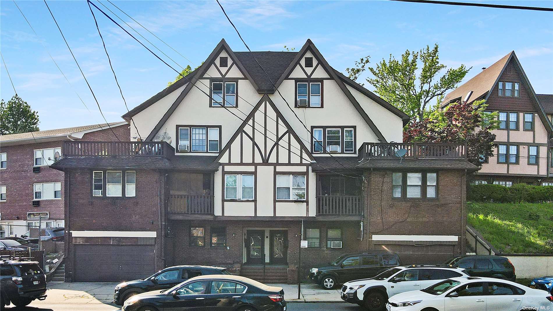 a front view of a house with parking space