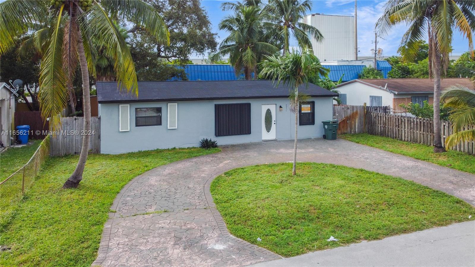 a backyard of a house with a garden and plants