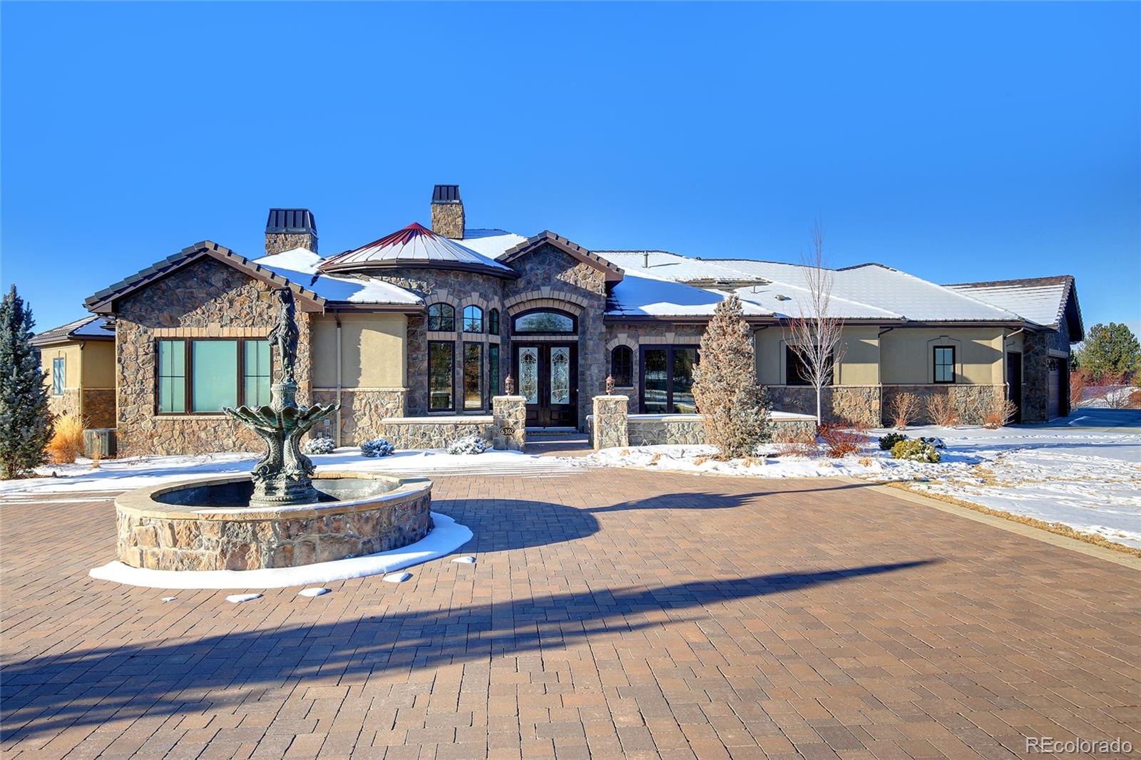 a view of a house with swimming pool and porch