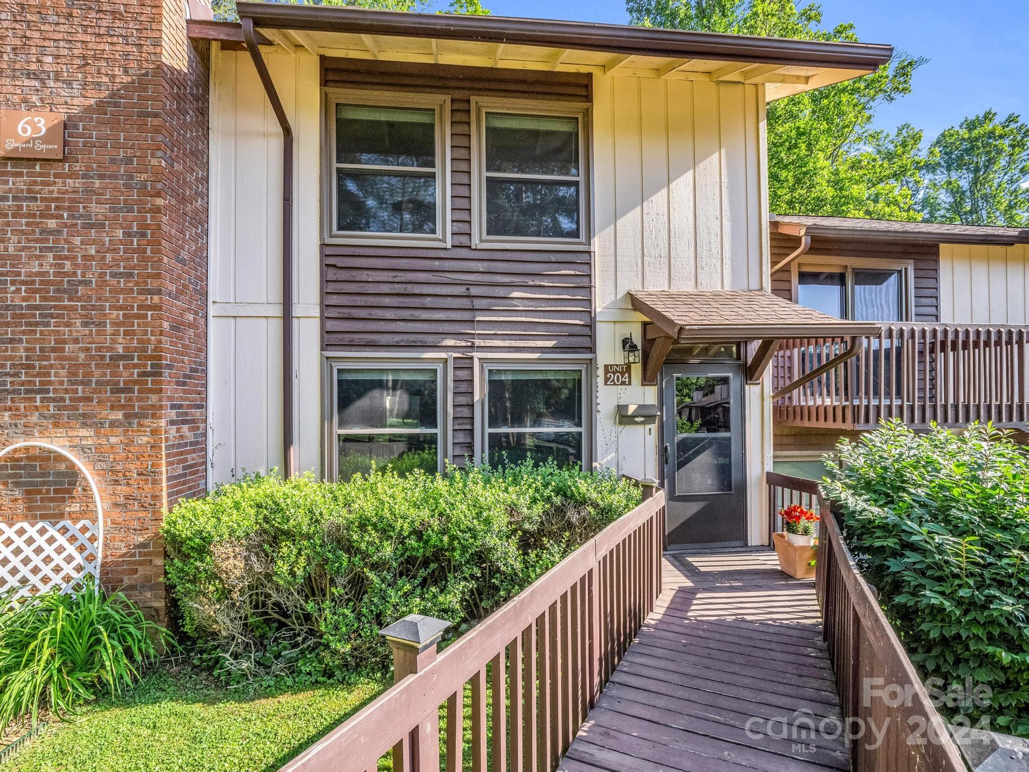 a balcony with wooden floor and outdoor space