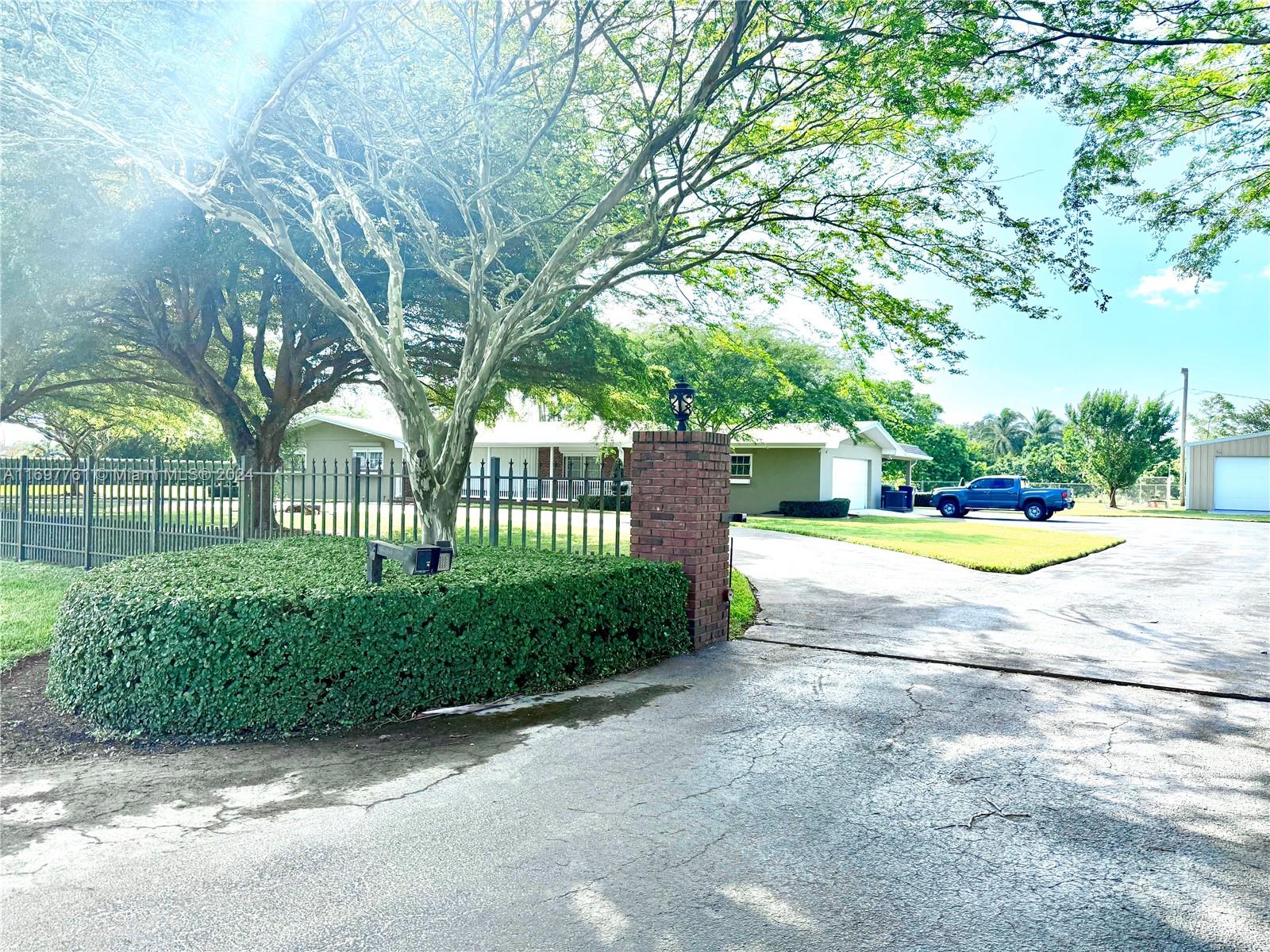 a view of yard with swimming pool and garden