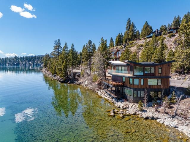 a view of a lake with a house in the background