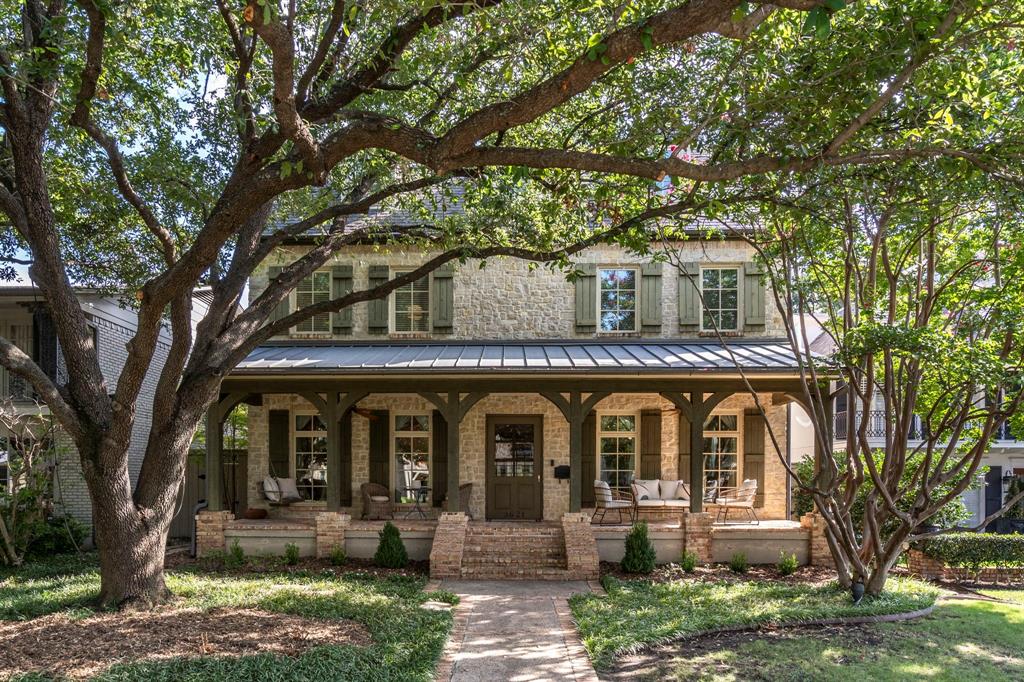 front view of a house with a tree