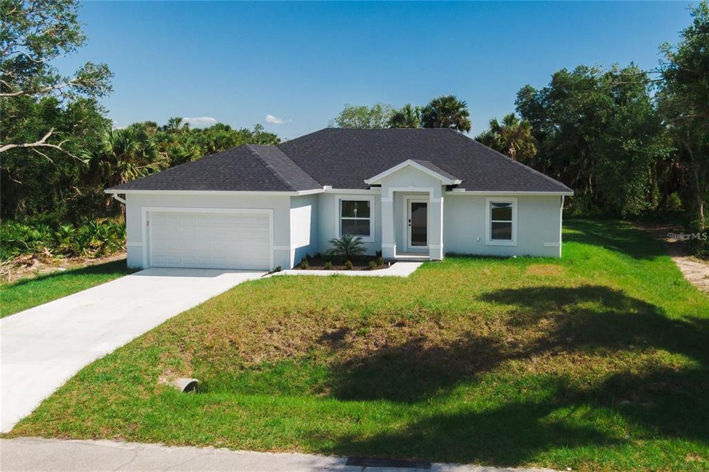 a view of a house with a yard