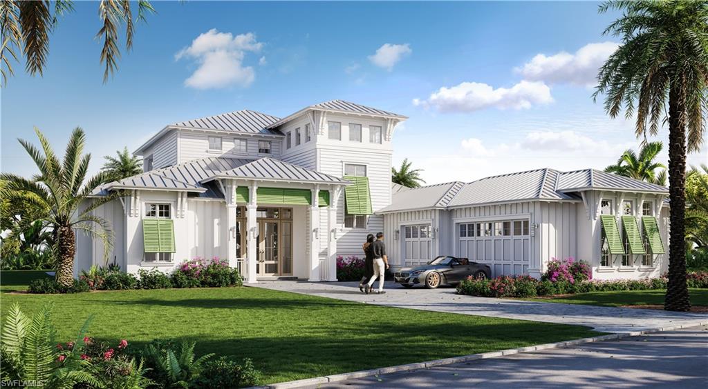 View of front of home featuring a front yard and a garage