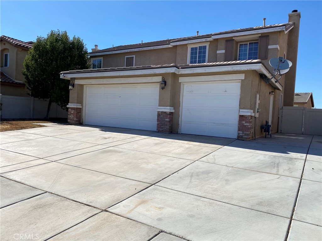 a front view of a house with a garage