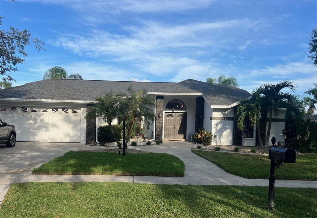 front view of a house with a yard