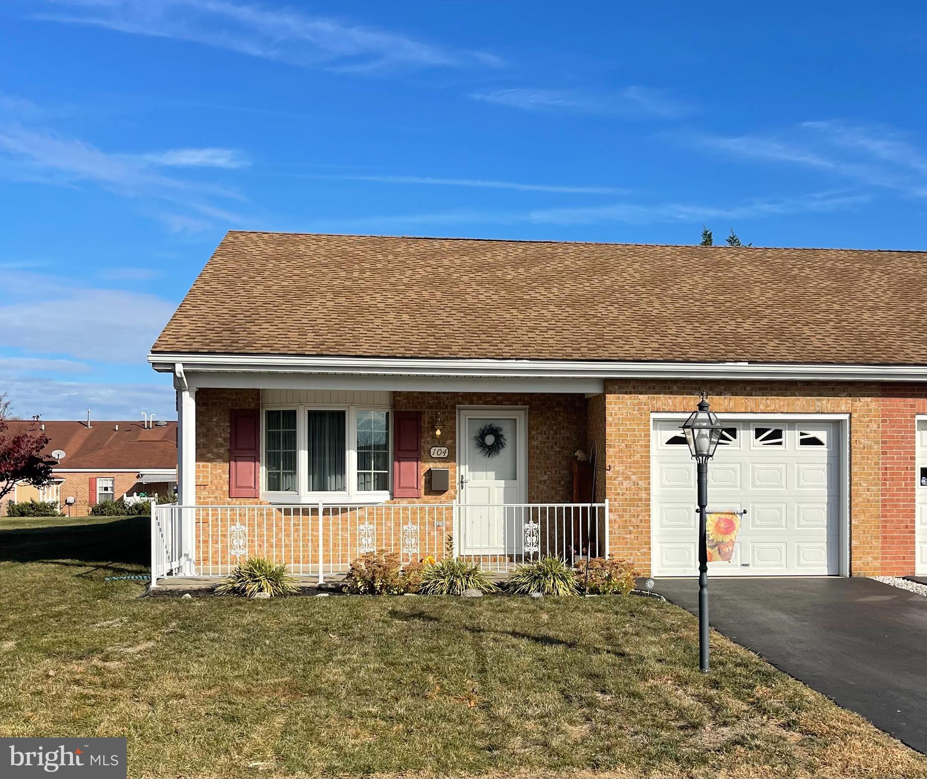 a front view of a house with garage