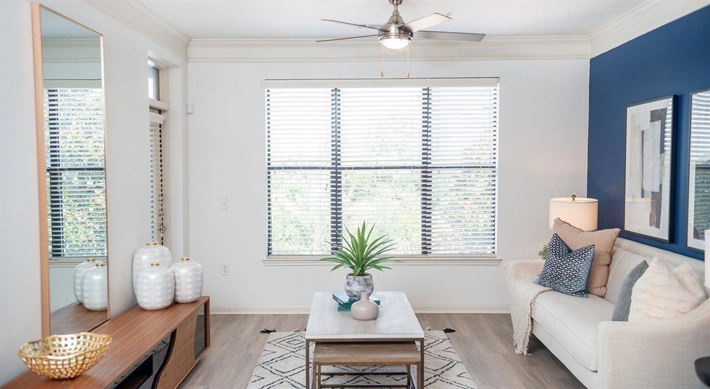 a living room with furniture and window