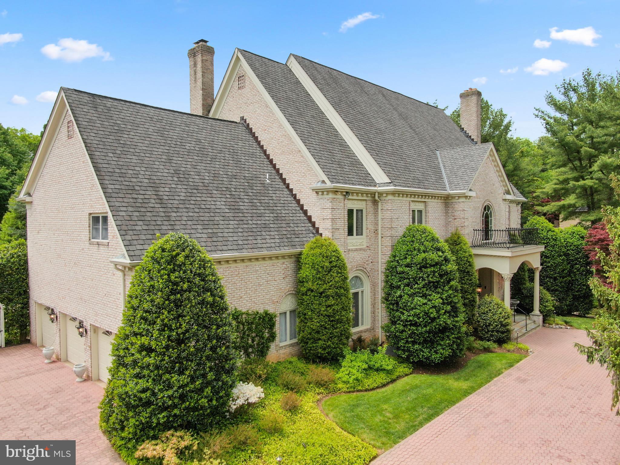 a aerial view of a house with a yard and plants