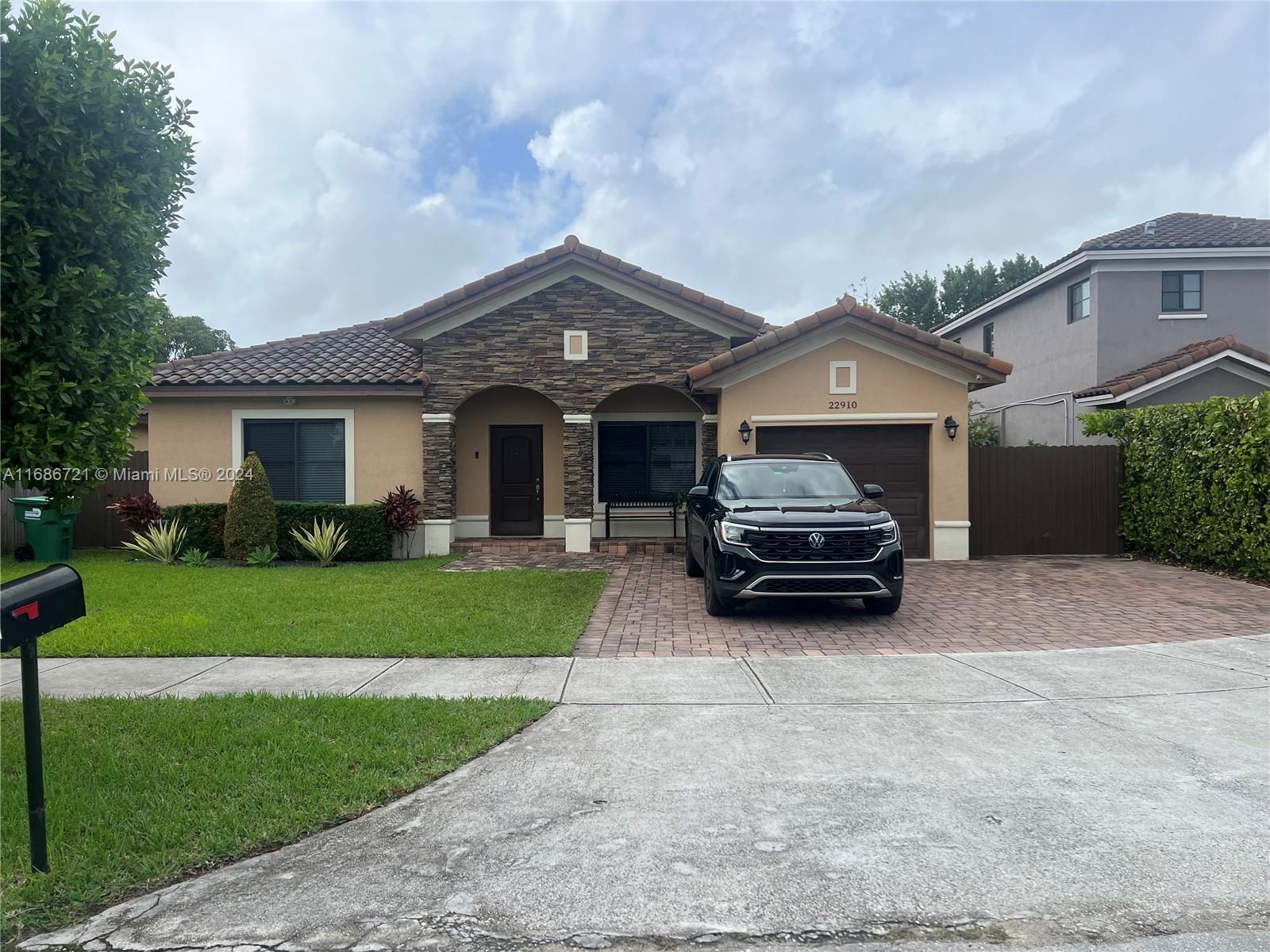 a car parked in front of a house