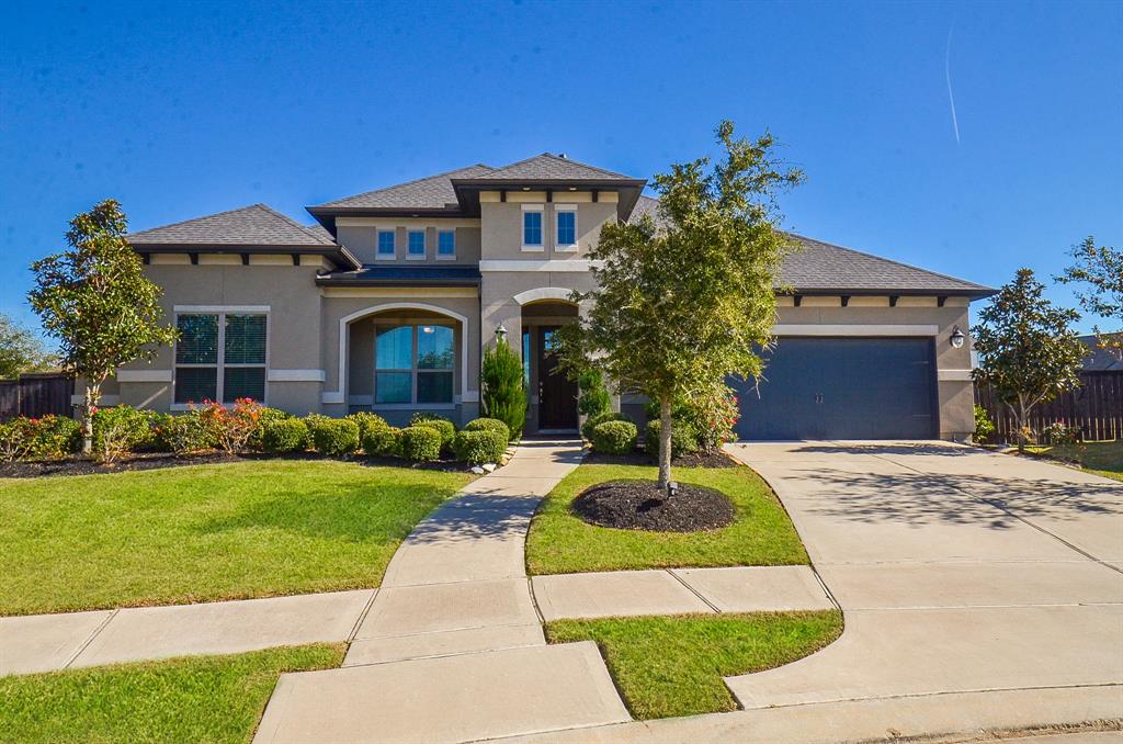 Blue skies above, impeccable landscaping below and a magnificent home like no other are all calling your name!This stucco beauty is located in a cul-de-sac at 7037 North Savannah Run, Katy, TX, in the master planned Cane Island community.