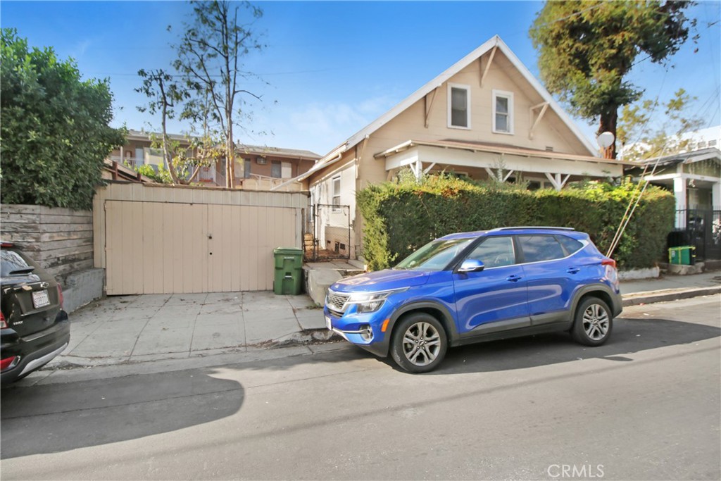 a view of a car parked in front of a house