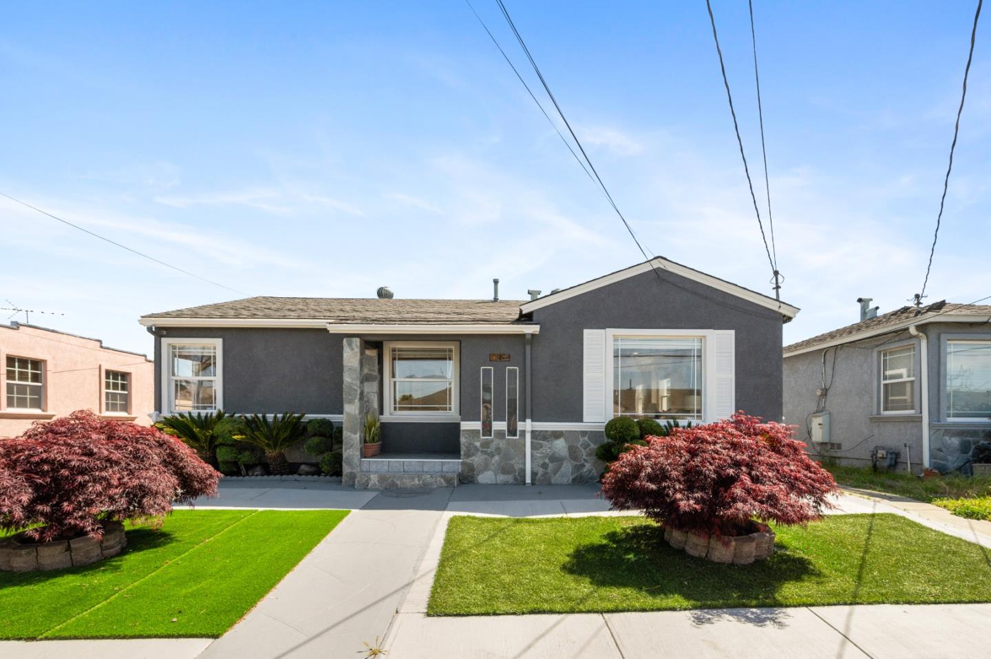 a front view of a house with a yard