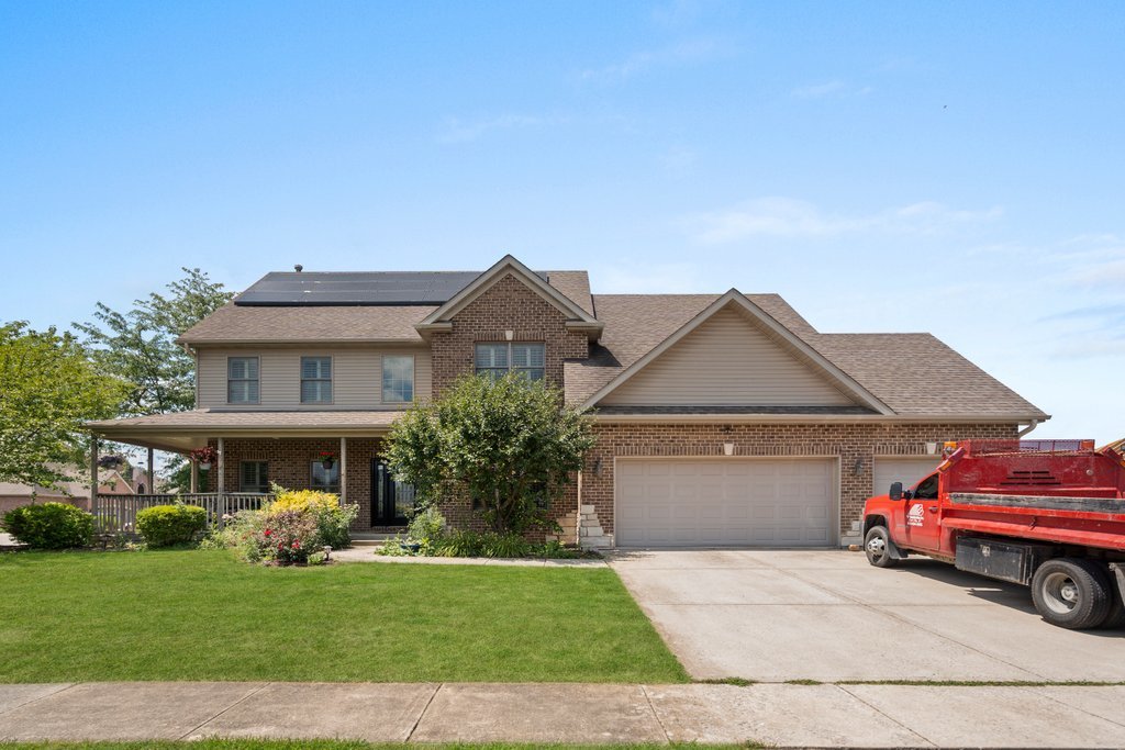 a front view of a house with garden