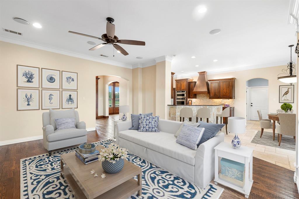 a living room with furniture or couch and a chandelier