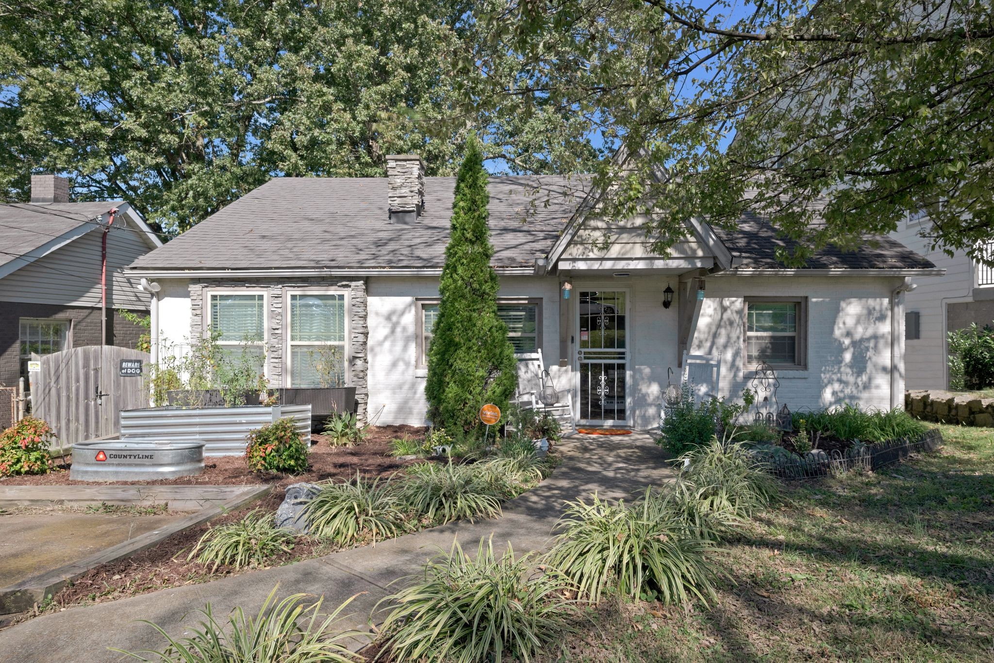 a front view of a house with garden