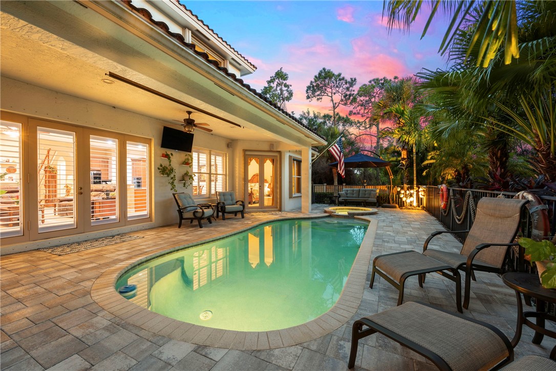 a view of swimming pool with outdoor seating