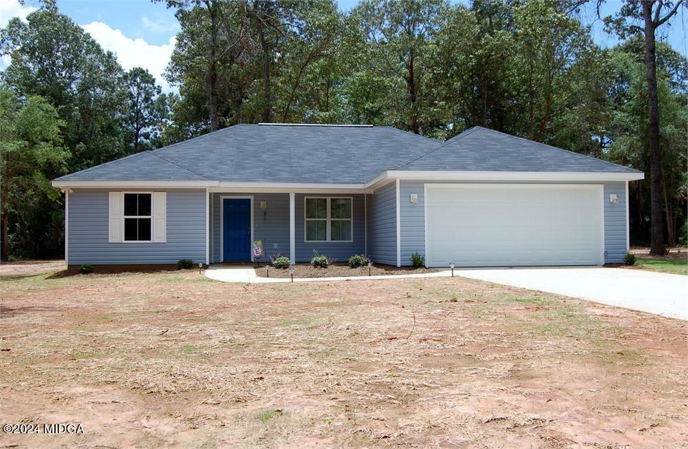 a house with yard in front of it