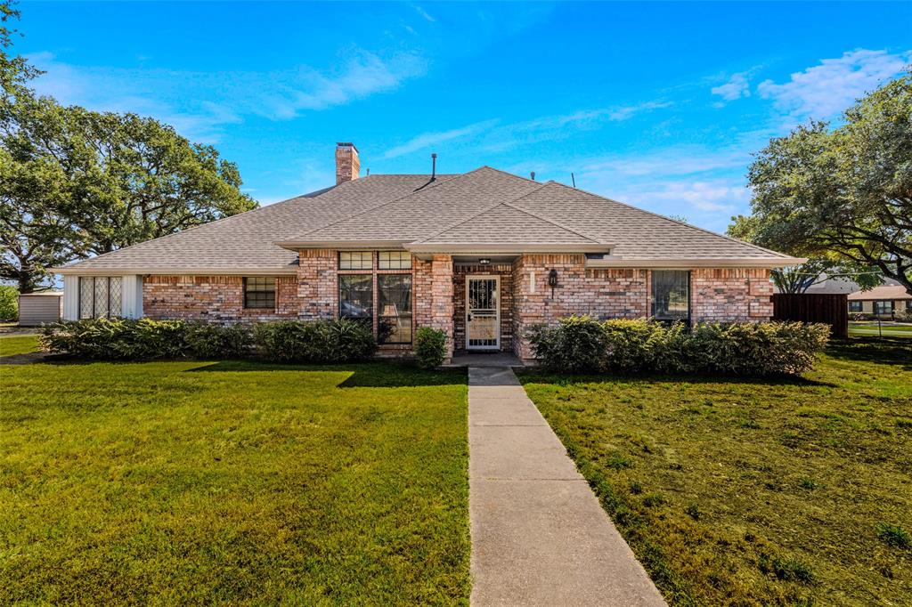 a front view of a house with yard