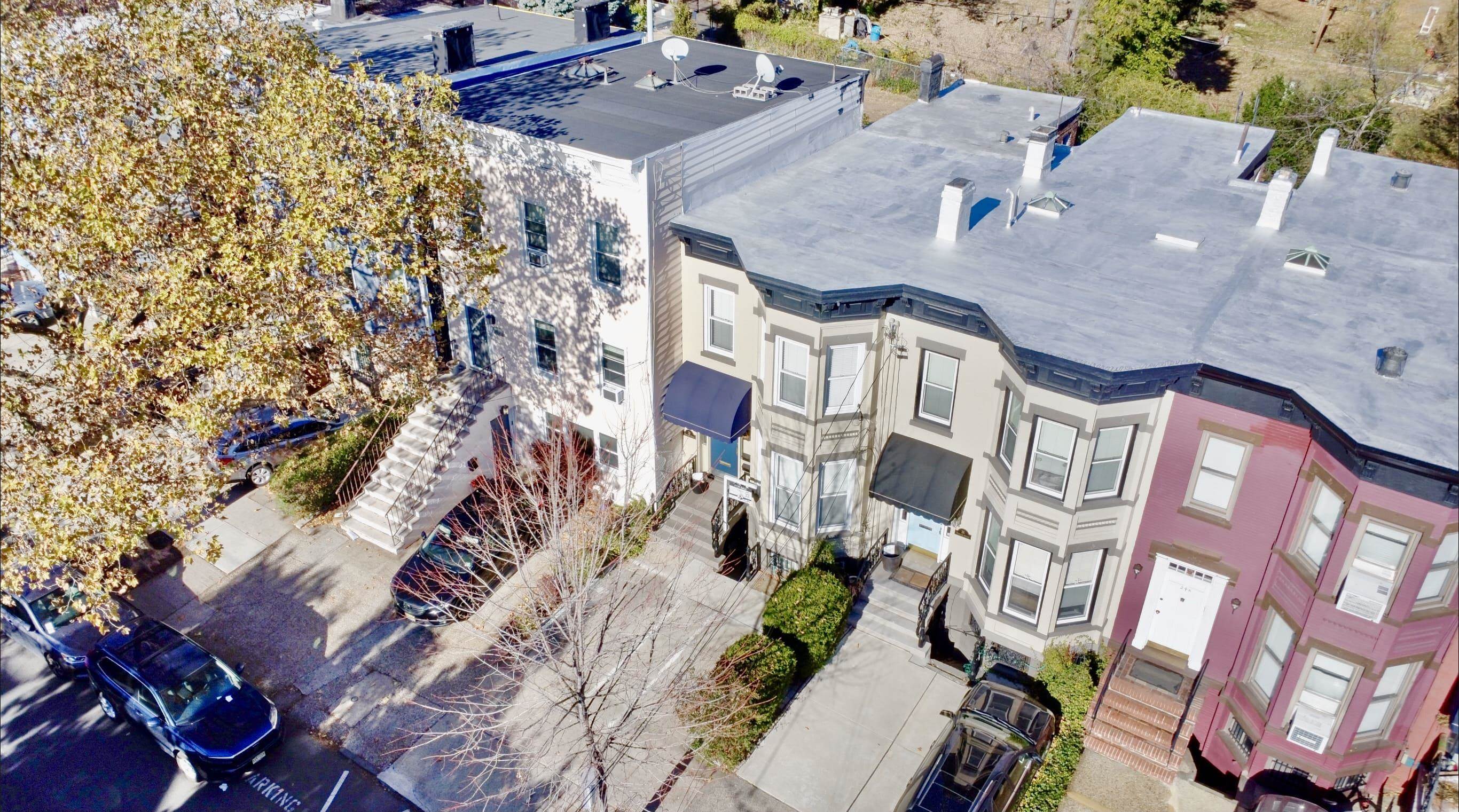 an aerial view of residential houses with outdoor space