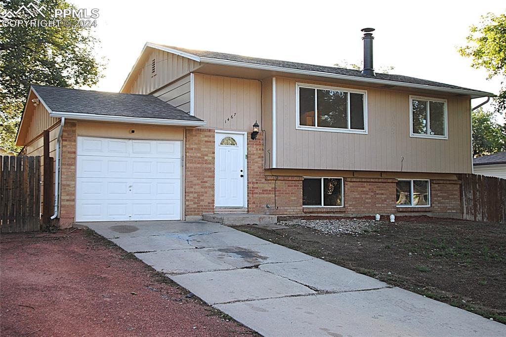 View of front of property with a garage