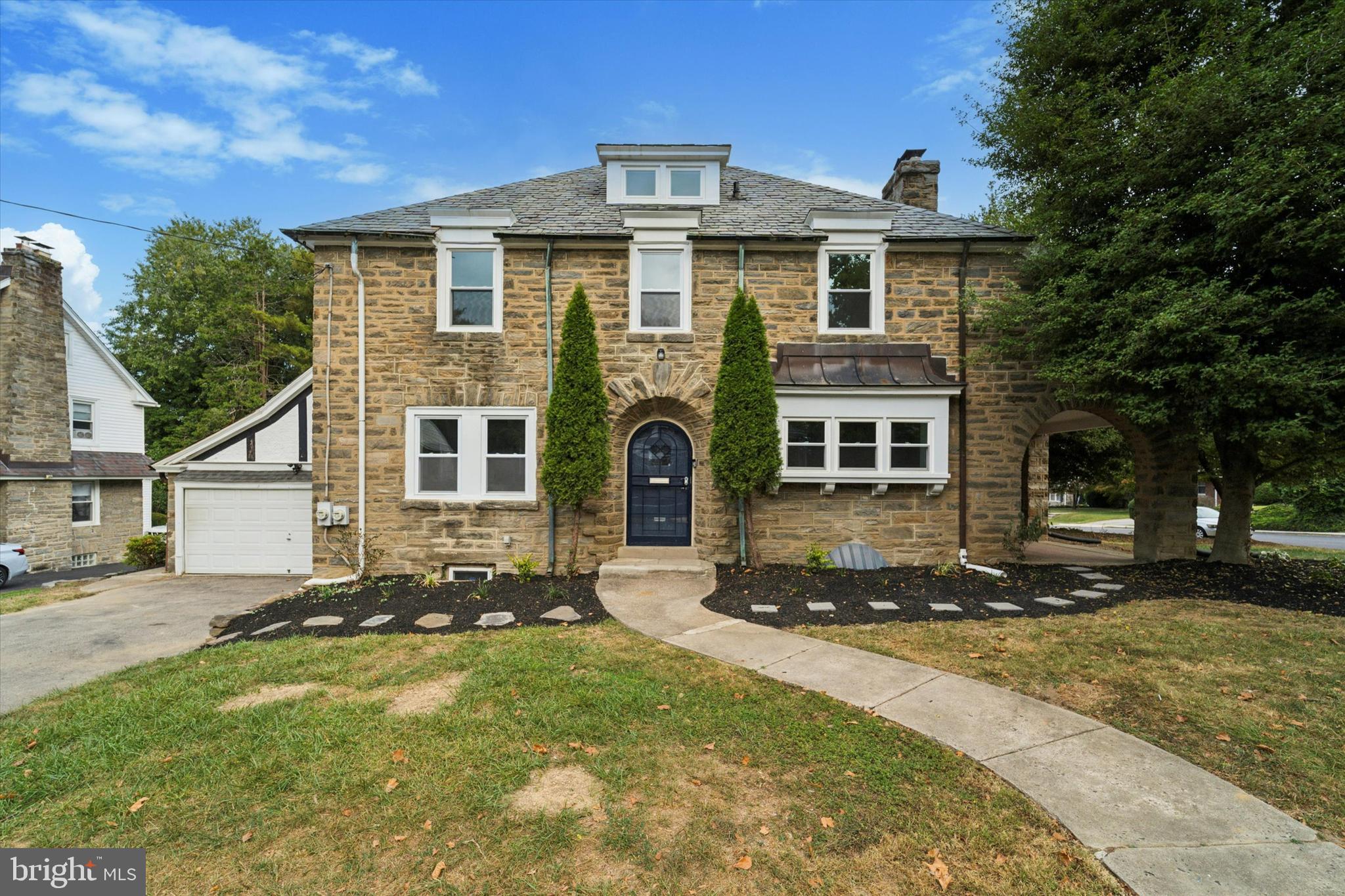 front view of a house with a yard