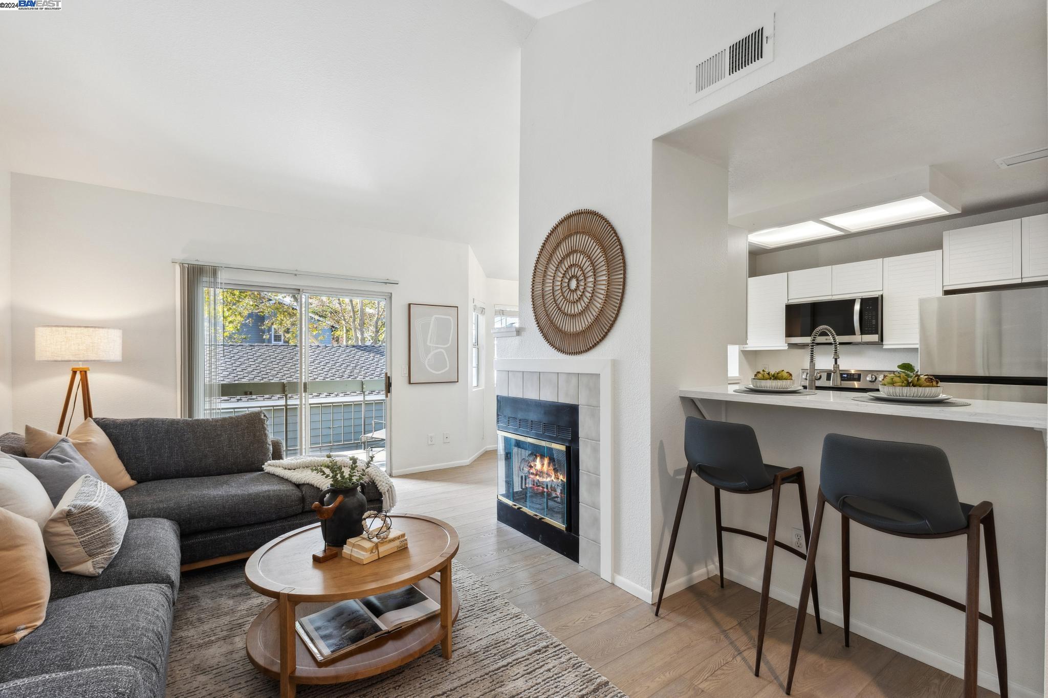 a living room with furniture a clock and a window