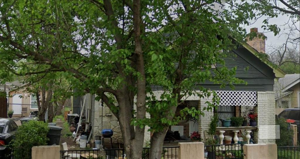 a view of a house with a tree