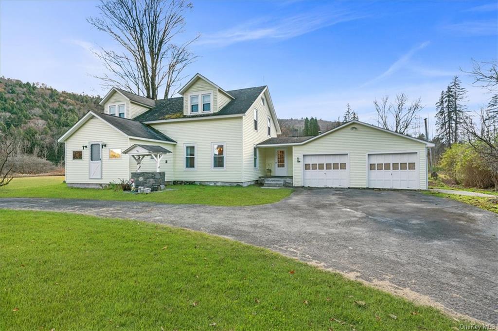 a view of a house with a yard