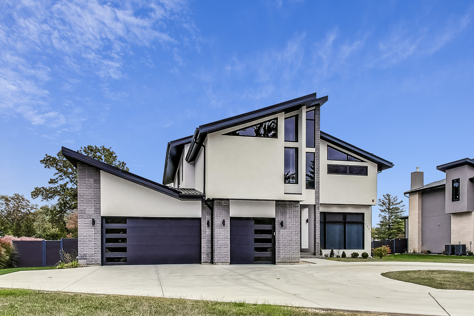 a front view of a house with a garage