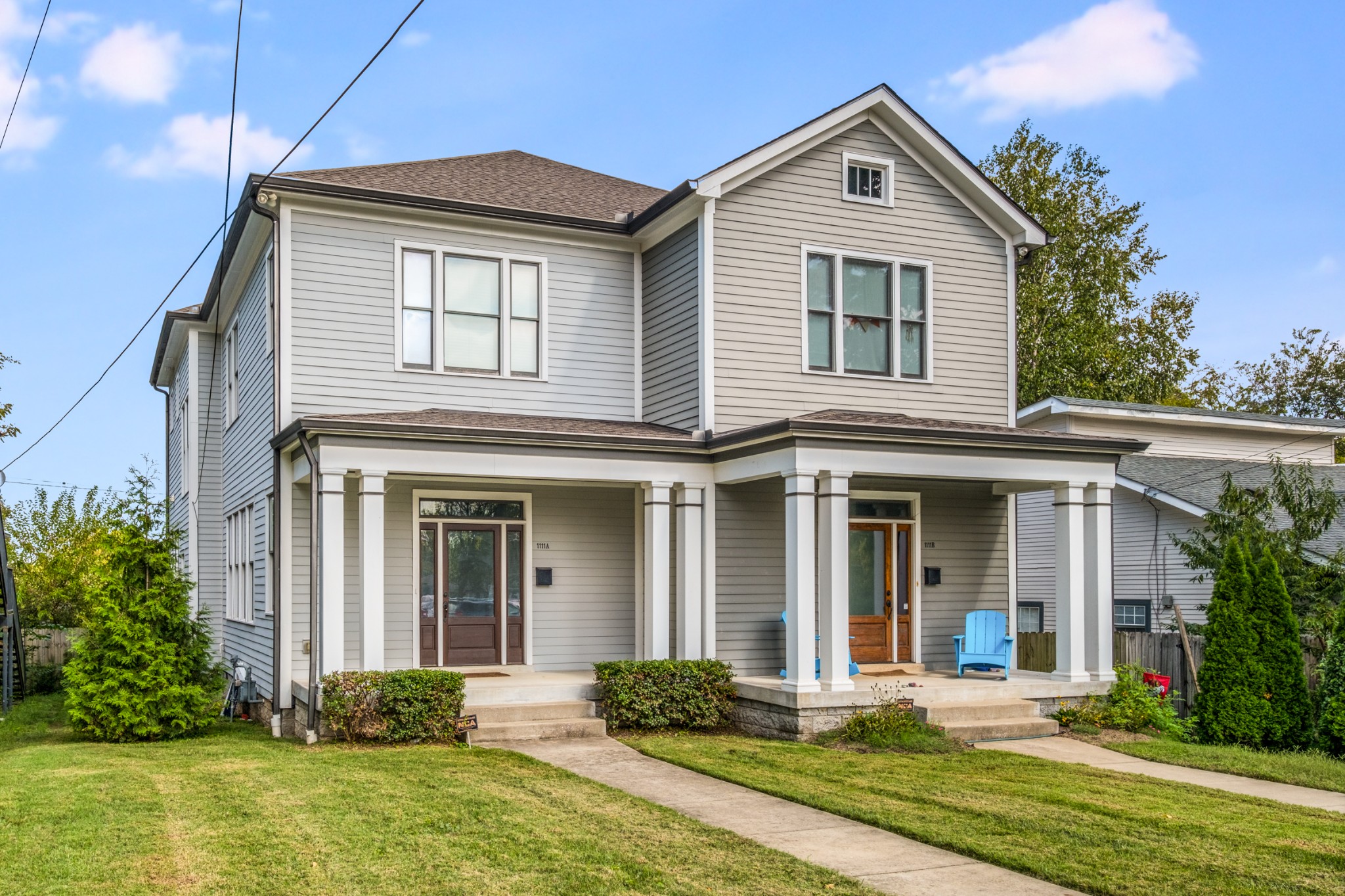 a front view of a house with a yard and porch