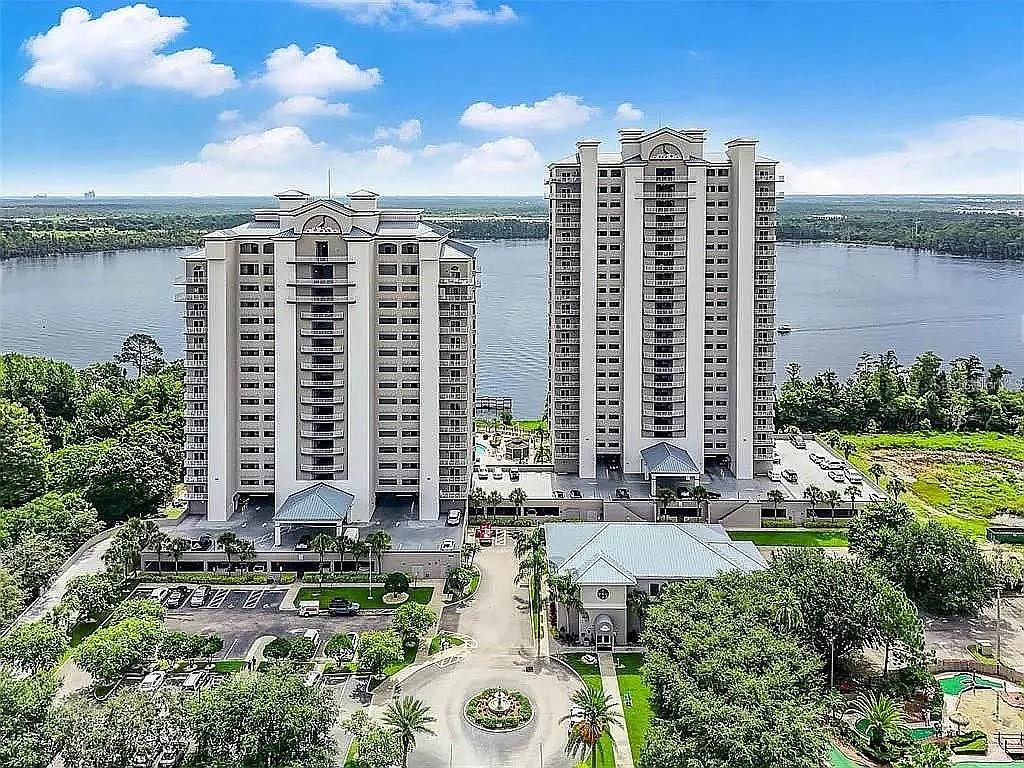 a view of building with outdoor space and lake view