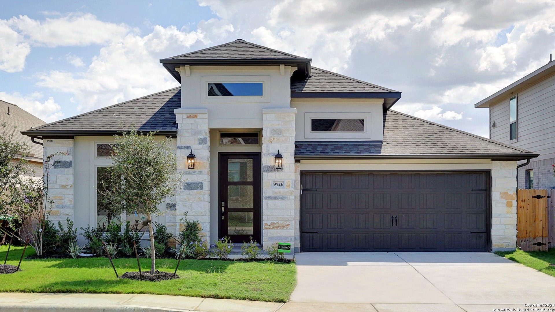 a front view of a house with a yard