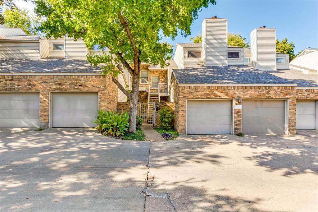 a view of a house with a yard and garage