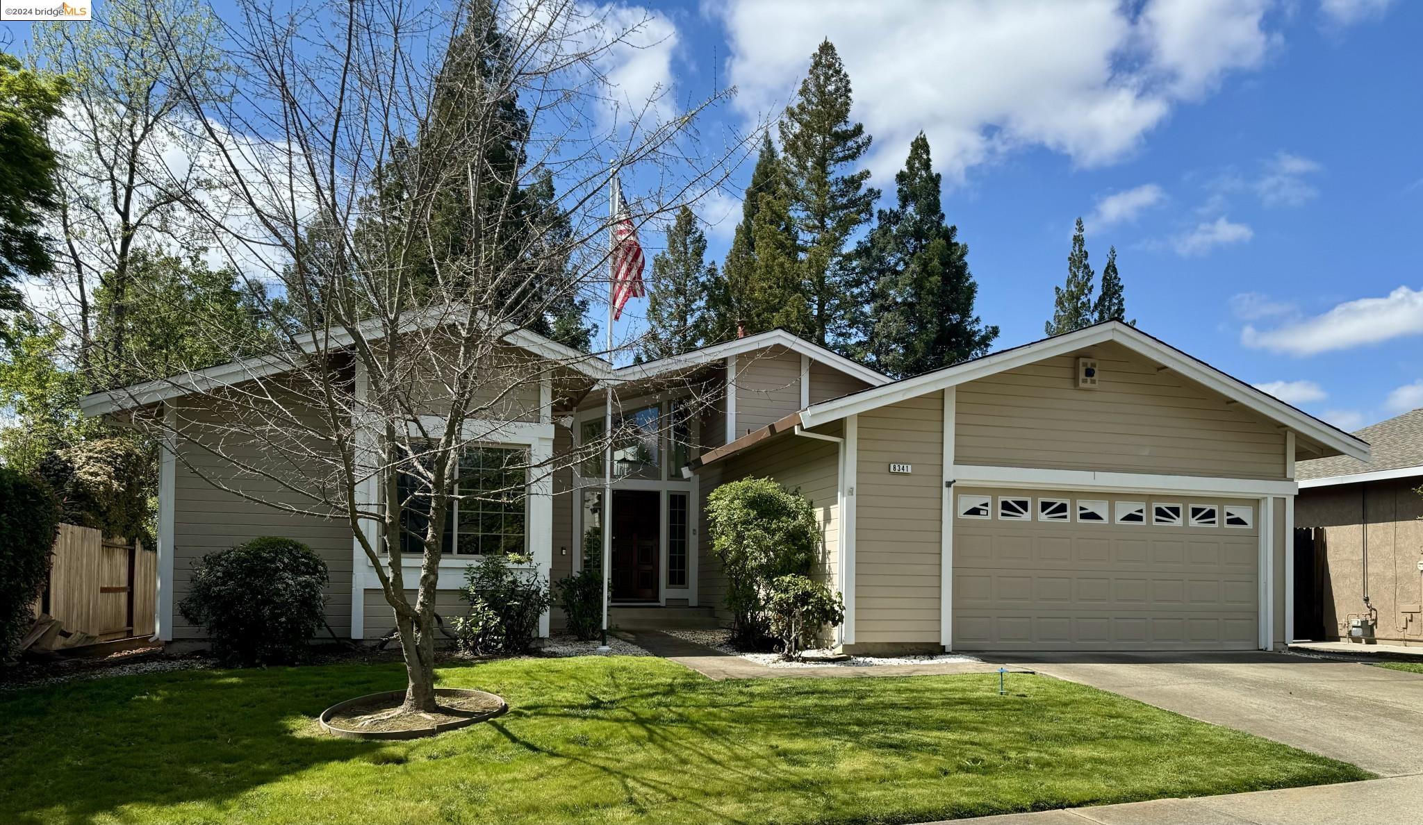 front view of a house with a yard