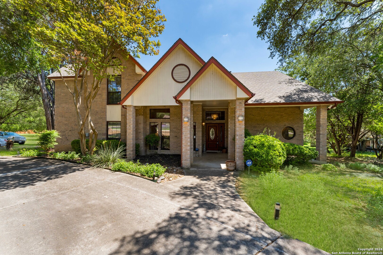 a front view of a house with garden