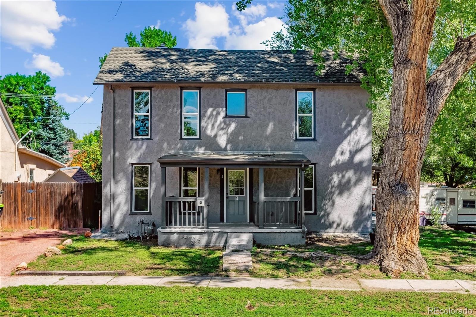 front view of a house with a yard