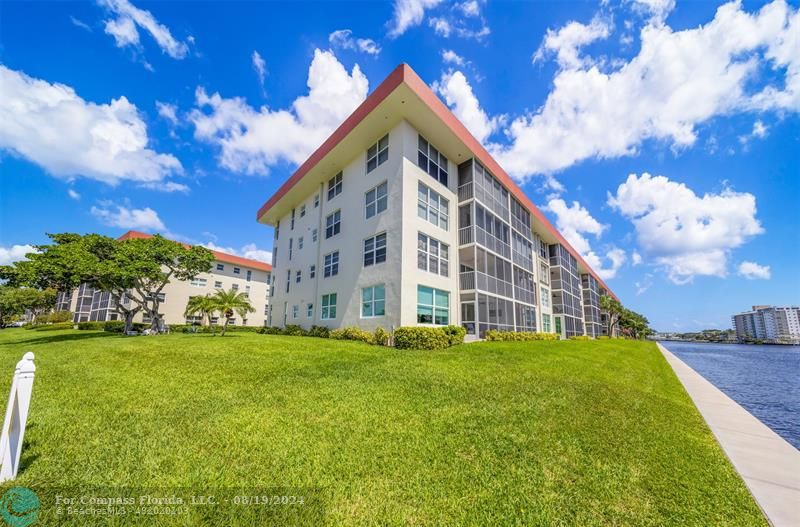 a view of a building with a big yard