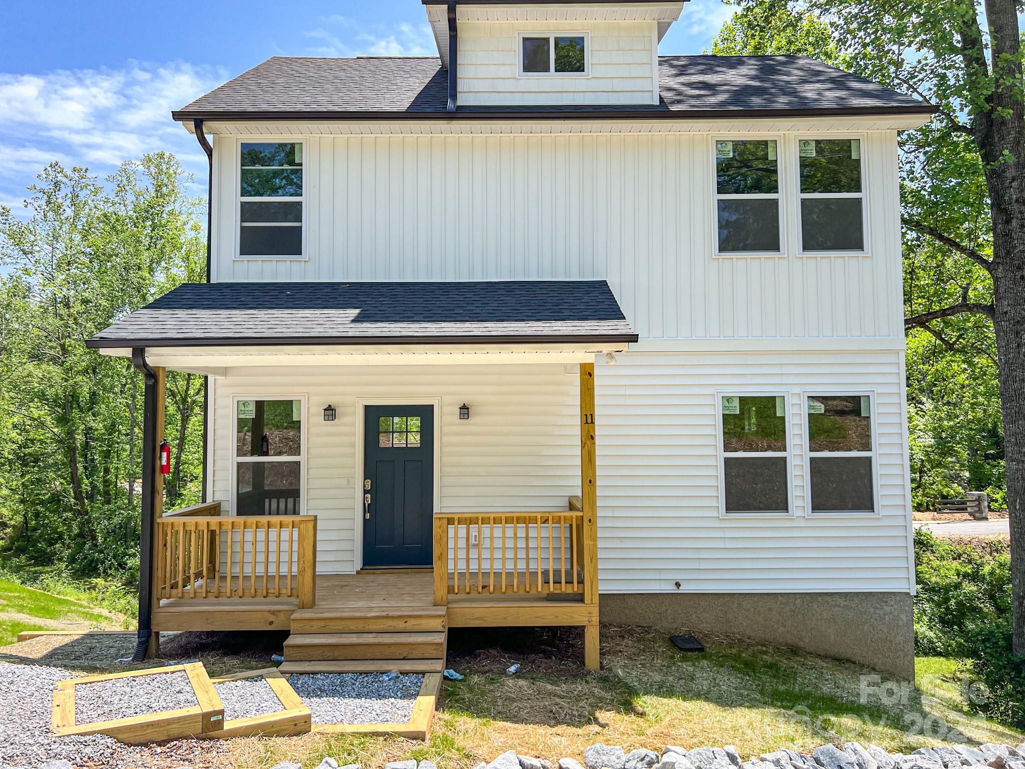 a front view of a house with a garage