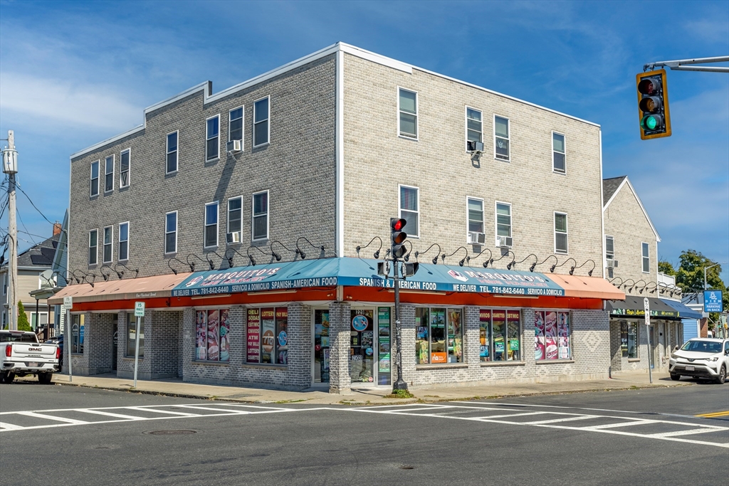 a large building on the side of a street