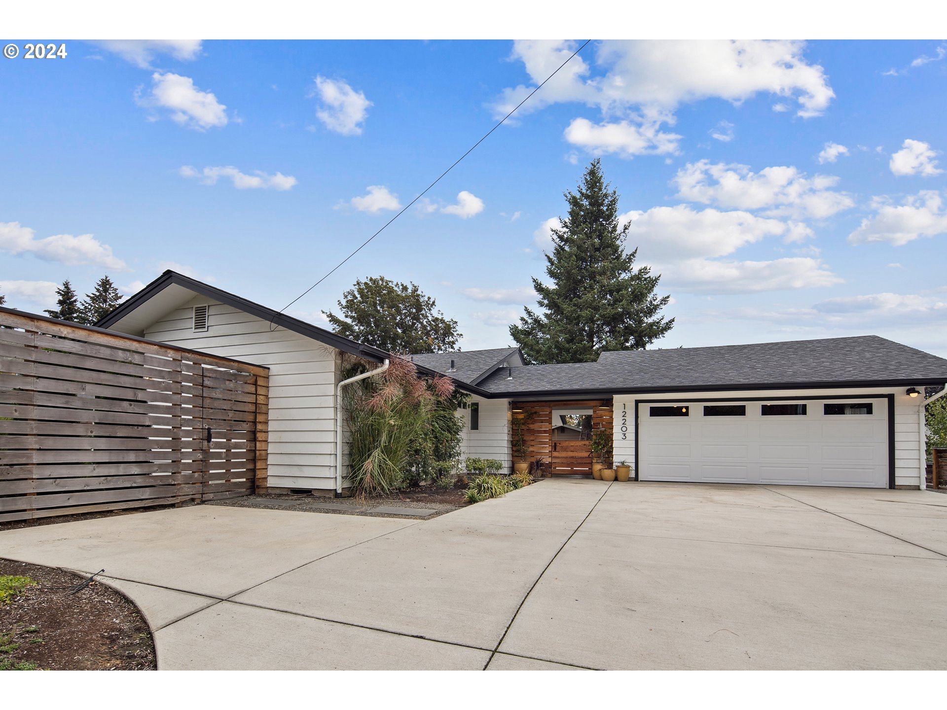 a front view of a house with a garage