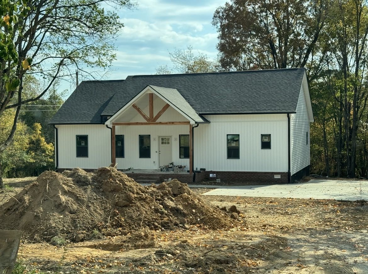 a house with trees in the background