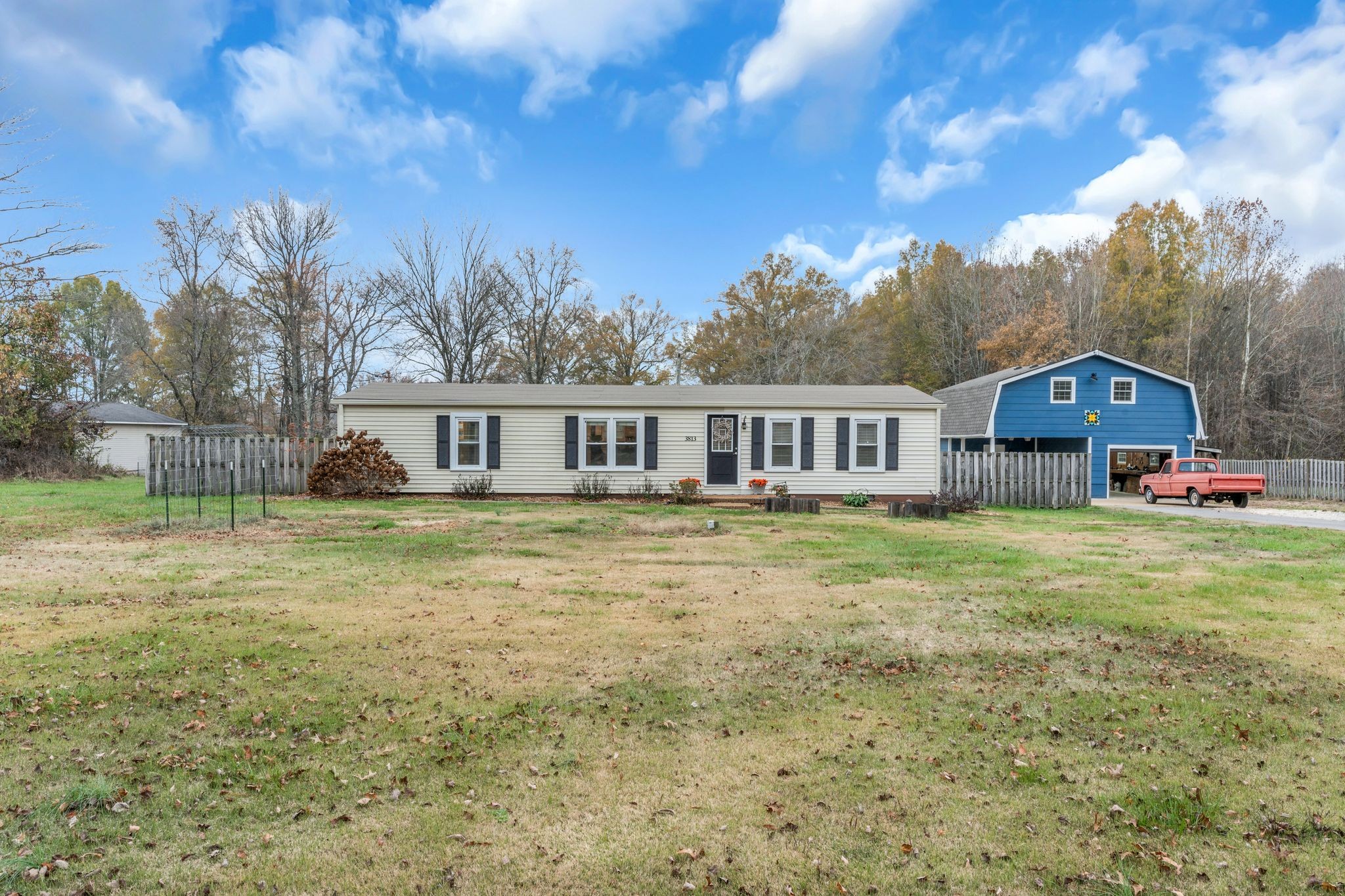 Home is on 5.2 acres and has a One Car / One Carport Detached Garage with Unfinished Room Above.