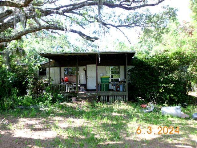 a view of house with yard