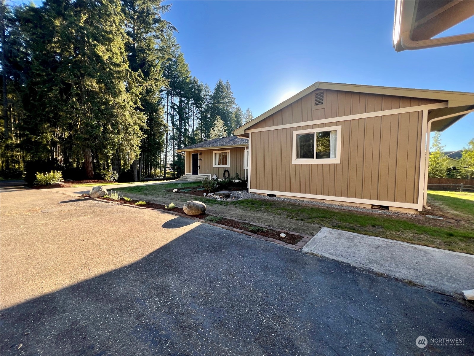 a backyard of a house with yard and garage